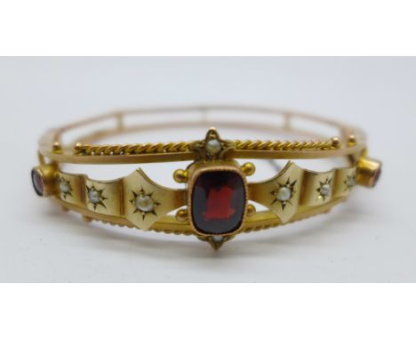 A 9ct gold, garnet and pearl bangle, a/f, 8.5g