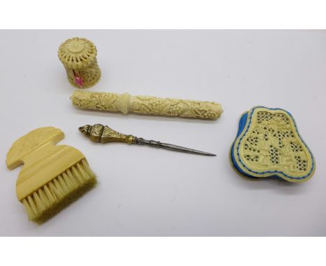 Needlework items including an ivory brush and a carved pin cushion