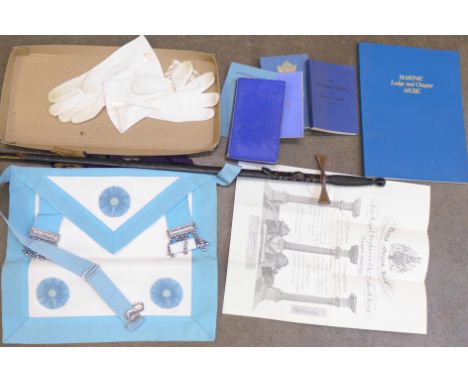 A collection of Masonic items including ceremonial sword and scabbard