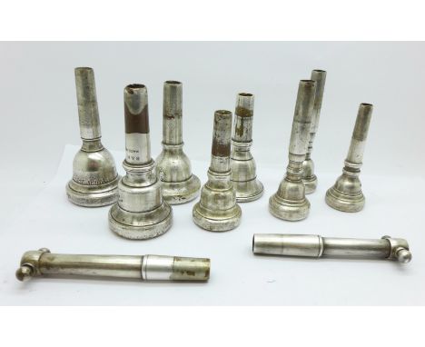 Eight wind instrument mouthpieces, including Kosicup, Yamaha 47 and two trumpet extensions