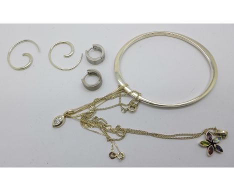 A silver bangle, other silver jewellery and a pair of earrings