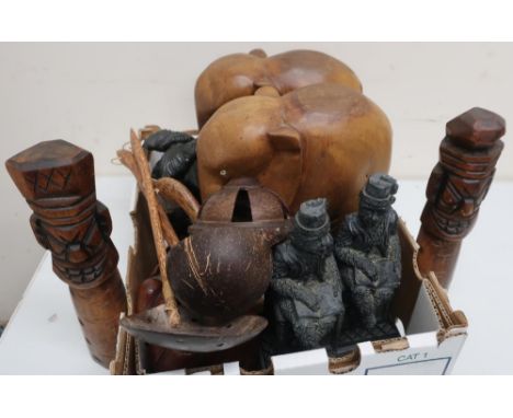 Two pairs of hardwood carved elephants, two carved wooden figures, Eastern ladle, skimmer and two monkey figures etc 