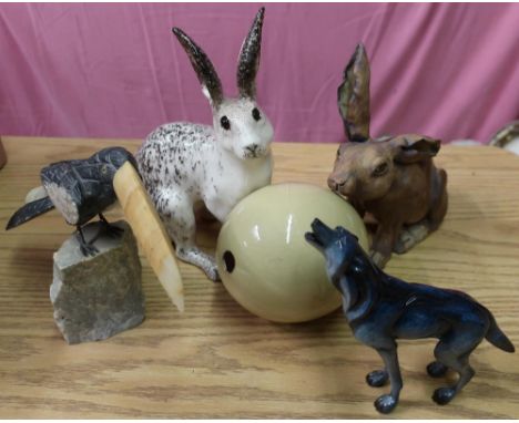 Two studio ceramic hares, Imago figure of a wolf, large ceramic egg, and carved stoneware bird 
