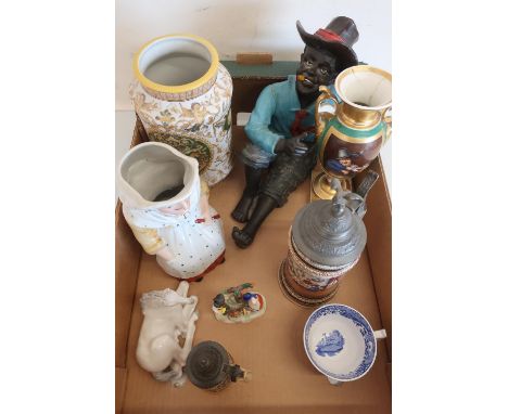 Three Paris style porcelain vases decorated with figures and landscapes, two German beer steins, a resin model of a seated bo