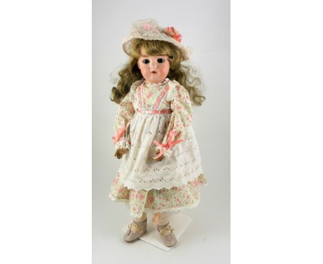 A Kammer & Reinhardt/S&H bisque head doll, German circa 1910, with weighted brown glass eyes, open mouth, upper teeth and lat