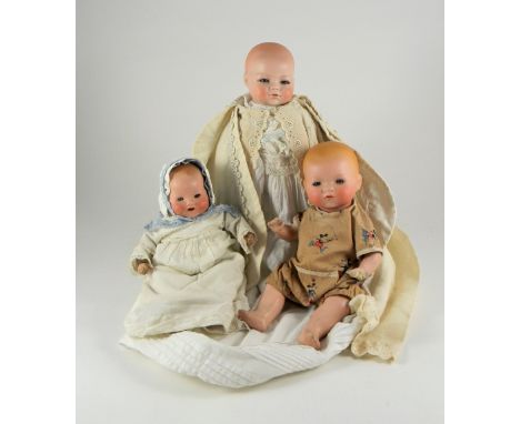 Schoenau & Hoffmeister ‘Pouty baby’ doll, German circa 1920, with weighted blue glass eyes, closed mouth and on a cloth body 