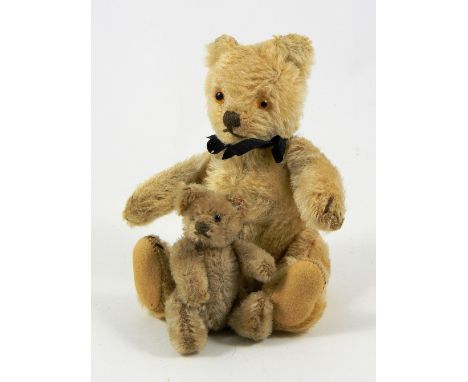 Two small Steiff Teddy Bears, circa 1950, blonde mohair bear with glass eyes, stitched nose, mouth and claws, swivel head and