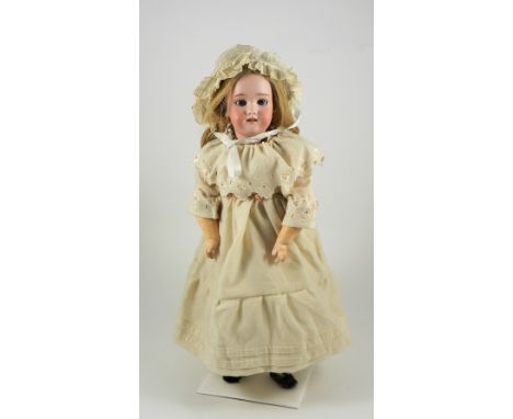 A Heinrich Handwerck bisque head Mama/Papa doll, German circa 1910, with weighted blue glass eyes, raised eyebrows and open m