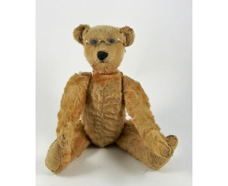 A German Golden mohair Teddy Bear, probably Strunz circa 1910, straw stuffed with black button eyes, black stitched nose, mou