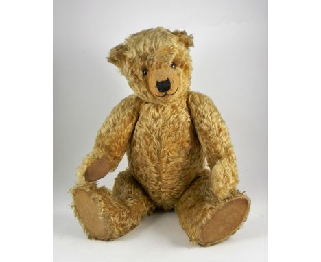 Trevor a fine and large Chiltern golden mohair Hugmee Teddy Bear, circa 1930, kapok and wood wool stuffed with large glass ey