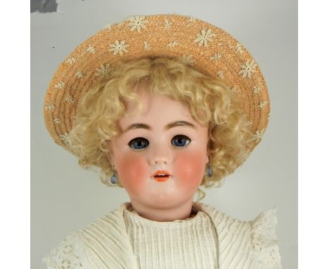 A large Heinrich Handwerck/S&H bisque head doll, German circa 1910, with beautiful pale bisque head, weighted blue glass eyes