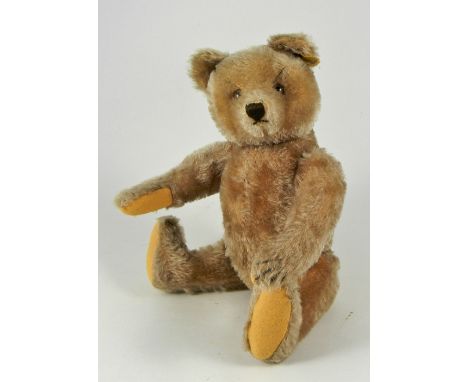 A Steiff light brown mohair Original Teddy, 1950s, straw stuffed shorter mohair bear with brown glass eyes, vertically stitch