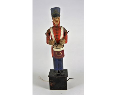 Interesting wooden Automata of a British Army Drummer, probably mid 19th century, the wooden carved figure with painted red c