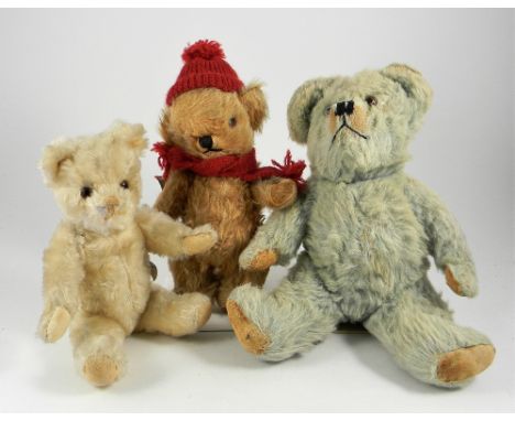 Three Teddy Bears including a Farnell Alpha Toffee Bear, circa 1960, golden mohair Toffee bear with glass eyes, stitched nose