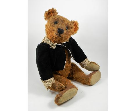 A rare and large centre seam Steiff cinnamon mohair Teddy Bear, circa 1909, straw stuffed with black button eyes, black stitc