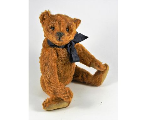 An early rare Steiff centre seam cinnamon mohair Teddy Bear, circa 1908, straw stuffed with black boot button eyes, stitched 