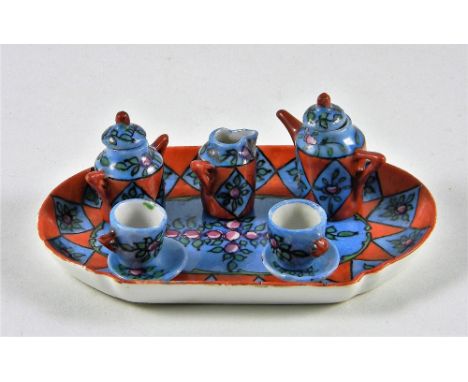 Miniature painted china Dolls Coffee Service, French, circa 1890, brightly painted in blues and oranges with flower decoratio