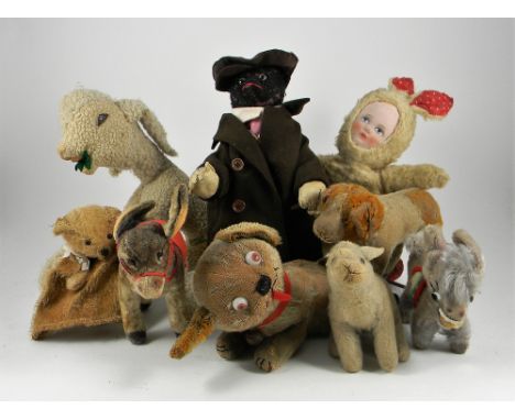 Collection of soft toys, including a small Steiff St.Bernard on wheels, mohair dog with glass eyes, stitched nose and mouth a