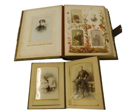 A Victorian leather bound musical photograph album, containing portrait studies, with a brass clasp, together with a further 