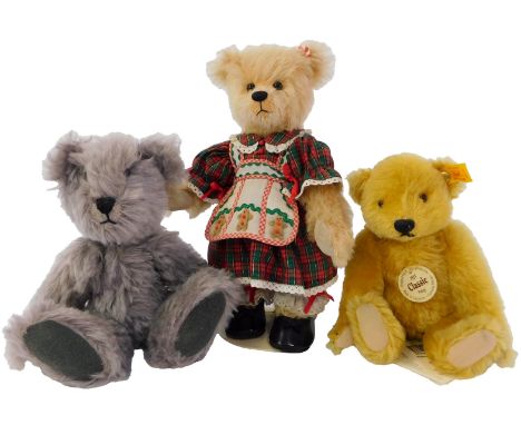 A Steiff 1927 Classic Petsy Teddy bear, 22cm high, together with a grey jointed Teddy bear, and a Franklin Mint Teddy bear, w