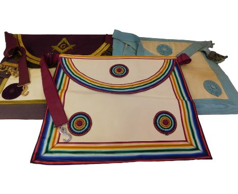 A Masonic regalia apron and sash, with a multicoloured rosette.