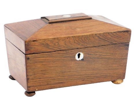 A Regency rosewood sarcophagus shaped tea caddy, with mother of pearl inlay, the hinged lid enclosing two lidded compartments