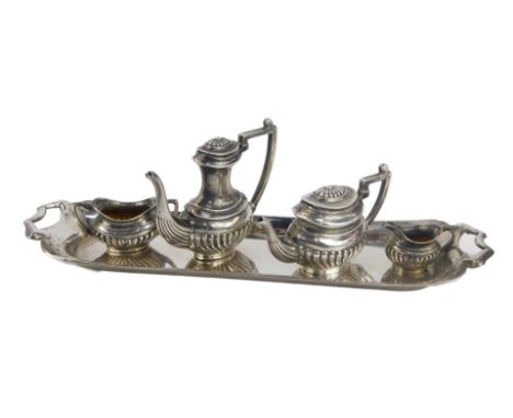 An Elizabeth II silver miniature tea service, comprising hot water jug, teapot, twin handled sugar bowl and milk jug, each of