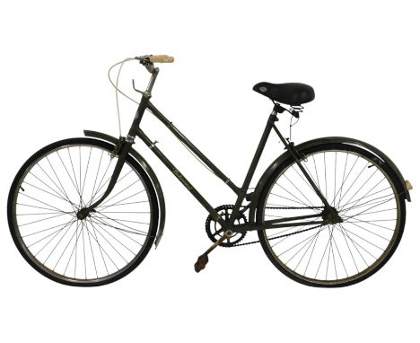 A vintage Hercules Balmoral lady's bicycle, with a green chassis, mud guards, and an ETC GelTech seat.