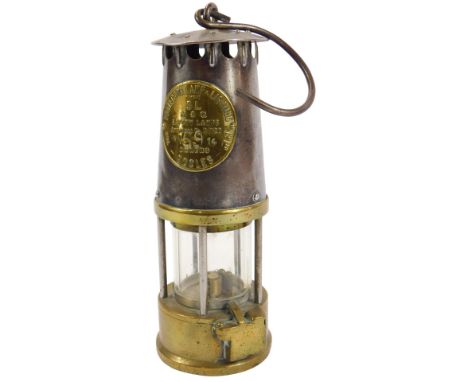 A Protector Lamp and Lighting Company Ltd Eccles type SL miner's lamp, number NN5914, with handle, 23cm high. 