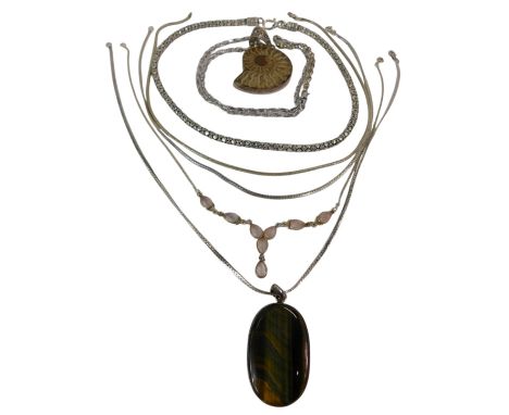Various silver jewellery, including an ammonite pendant with chain, three necklaces, a moonstone and silver necklace, and a t