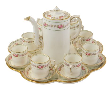 An Aynsley porcelain coffee service decorated with pink roses and violets, comprising coffee pot, six coffee cans and saucers