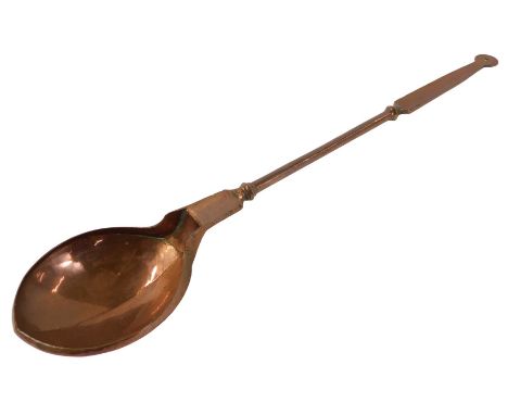 A Middle Eastern copper ladle, 41cm long. 