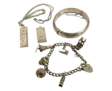 Silver jewellery, in the form of a bangle, a charm bracelet, and two silver pendants, 2.5oz all in. 