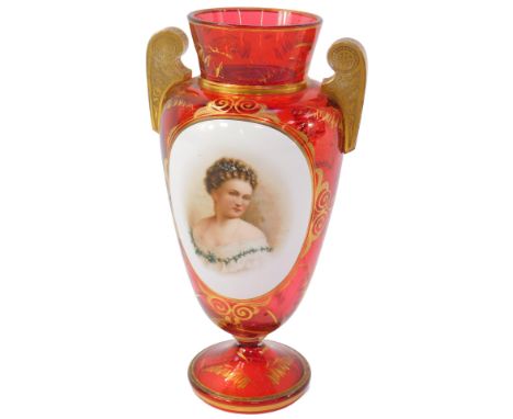 A late 19thC Continental cranberry glass twin-handled vase, with an oval white reserve painted with a head and shoulders port