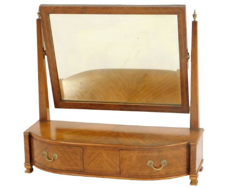 A Victorian walnut and cross banded swing frame toilet mirror, with a rectangular bevelled plate, on square tapering supports