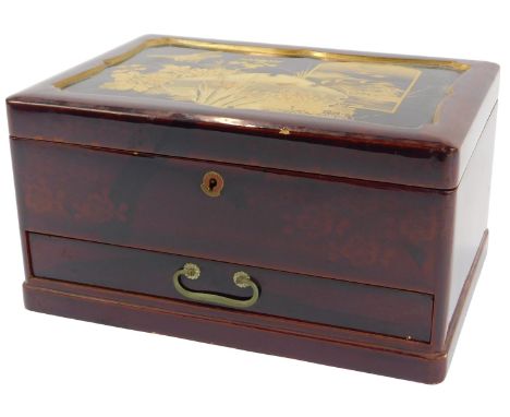A 20thC Japanese lacquered jewellery box, the hinged lid decorated with birds, flowers, etc., enclosing an interior with nine