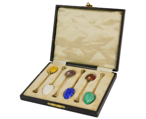A set of six George V silver gilt and guilloche enamel coffee spoons, with varicoloured bowls, cased, Birmingham 1913, 1.88oz