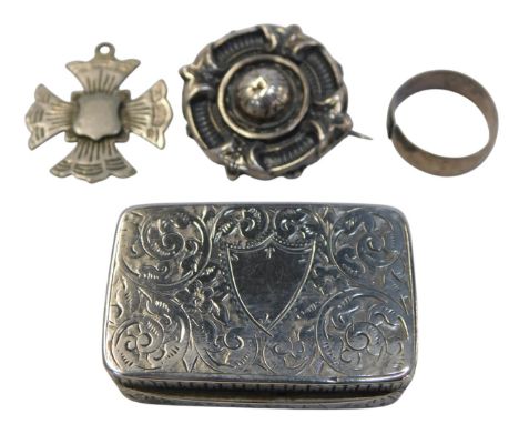 A Victorian silver snuff box, with foliate engraved decoration, Rose &amp; Brough, Birmingham 1895, a white metal brooch of c