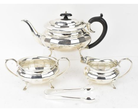 A George V silver three-piece tea set by William Adams Ltd, Birmingham 1927, comprising a teapot, twin-handled sugar bowl, an