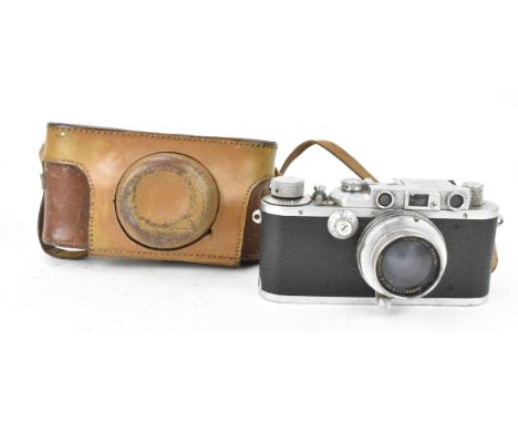 A cased Leica DRP No. 293142 Ernst Leitz Wetzlar Summar 50mm lens, in brown leather case 