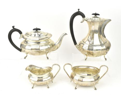 An Elizabeth II silver four piece tea and coffee set by Viner's Ltd, Sheffield 1954, comprising a teapot, coffee pot, twin-ha