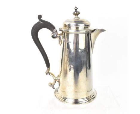 An Edwardian silver coffee pot by Martin, Hall &amp; Co, Sheffield 1903, of tapered cylindrical form, with turned finial, ebo