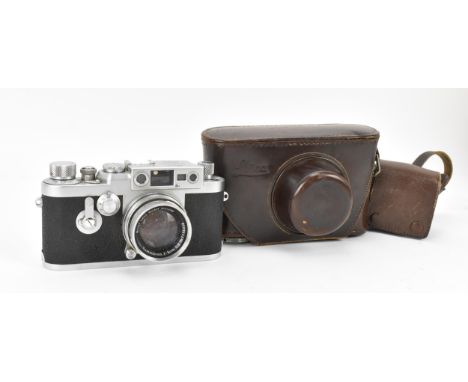 A cased Leica DBP No. 969911 camera with Ernst Leitz GmbH Wetzlar Summicron F=5cm 1:2 lens (No 1115338), in brown leather Lei