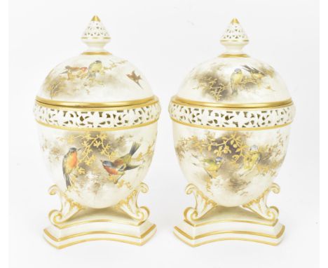 A pair of late Victorian Grainger &amp; Co Royal China Works Worcester reticulated pot pourri  lidded vases, painted with nat