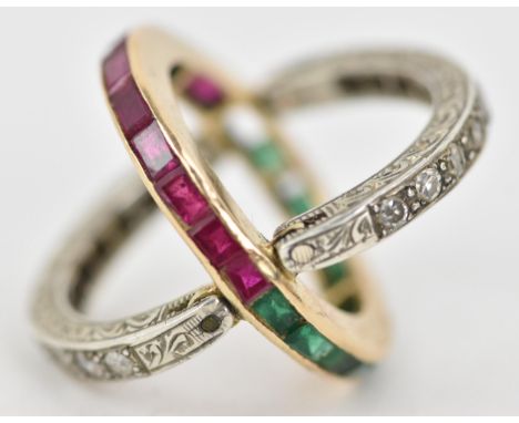 An Art Deco ruby, emerald and diamond swivel or flip eternity ring, the central hoop composed of a half row of calibre cut ru