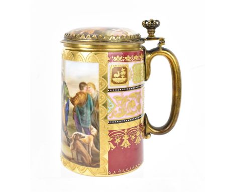 A brass-mounted Royal Vienna porcelain tankard, of cylindrical form painted with a figurative scene within a courtly setting 