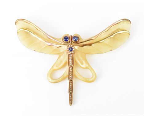 An Art Nouveau carved horn, blue sapphire and diamond inset dragonfly brooch in the style of Louis Aucoc, the carved horn wit