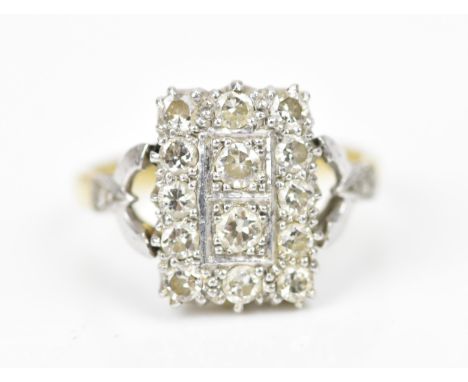 An 18ct gold, platinum and diamond tablet dress ring, of rectangular form set with fourteen brilliant cut diamonds, in a pier