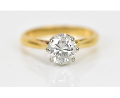 An 18ct yellow gold and diamond solitaire engagement ring, the brilliant cut stone in an eight claw setting, approx 1 carat, 