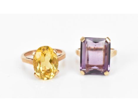 Two dress rings, to include a 9ct gold and citrine ring set with an oval cut stone in four claw setting, size L, the other wi